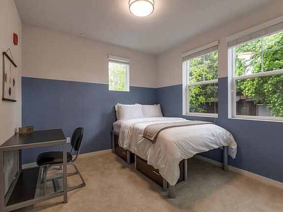 Get a good night's sleep! This room has a full size bed with a desk and chair.