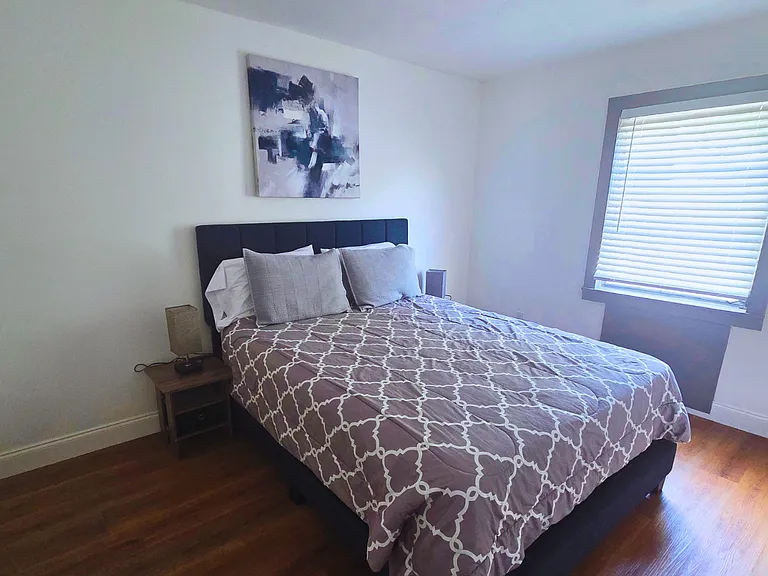 Comfortable studio with bedroom, living room, kitchen, workspace & bath.