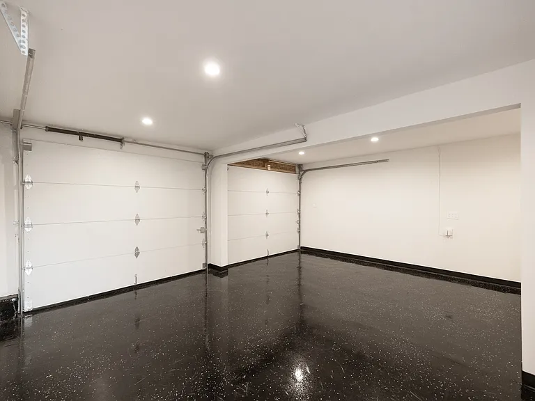 A spacious, polished garage ready for secure parking or extra storage.
