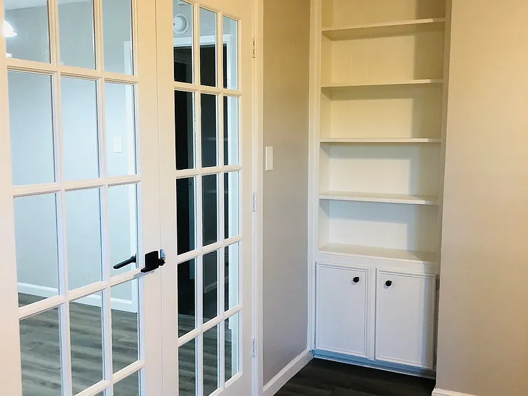 Fourth bedroom with closet/ Office. Beautiful French doors.