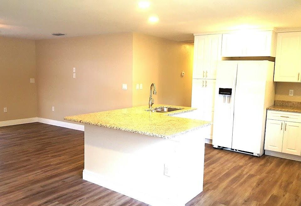 OPEN floor plan. Island with snack bar. Solid wood white shaker cabinets full extension drawers and soft close. Great room living room to kitchen, hall and living area.