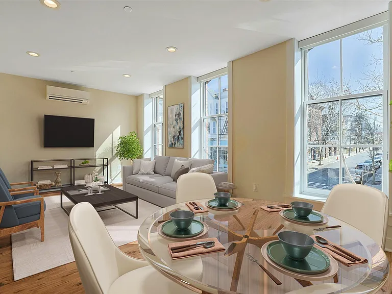 Dining Area: Virtually staged dining and living areas with floor to ceiling windows