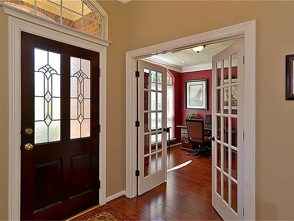 The gorgeous laminate wood flooring begins in the entry, and flows everywhere except bedrooms and ba
