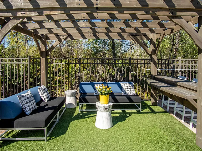 Unwind in shaded comfort under one of our inviting poolside pergolas, offering a luxe escape for relaxation.