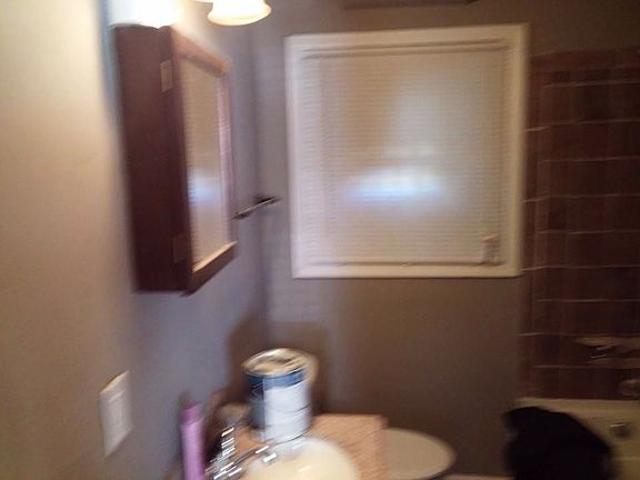 NEWLY TILED BATHROOM WITH PUSH BUTTON TOILETS