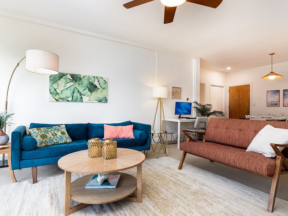 Modern coastal living room with West Elm seating, mid-century accents, and warm natural light.