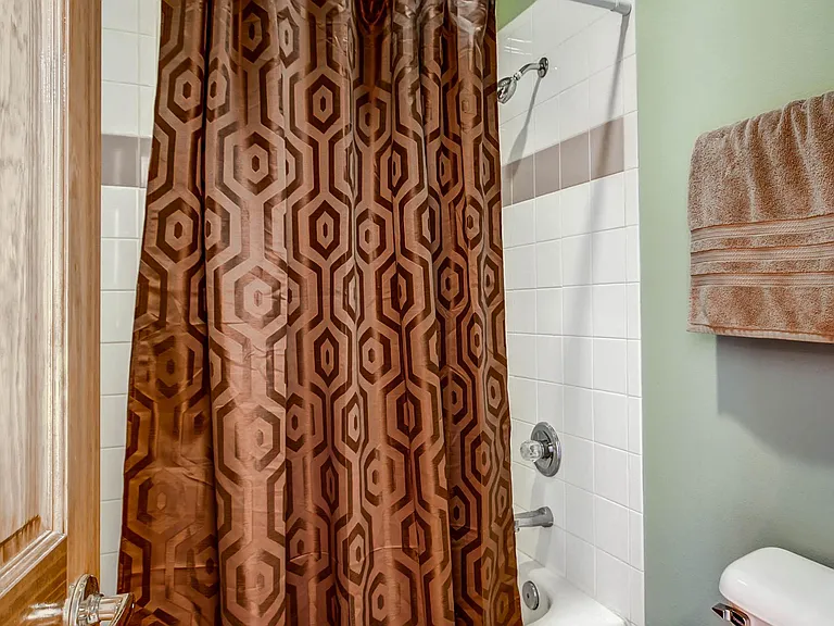 Third floor bedroom with private vanity and bathroom