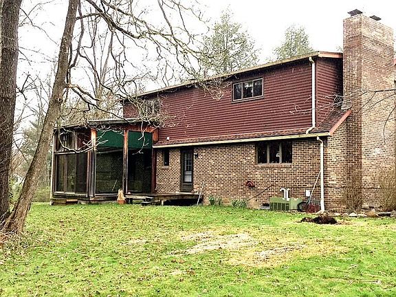 This is the back of the house - small deck and enclosed porch.