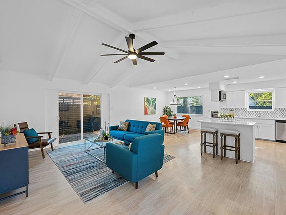 Family room open to kitchen and dining.