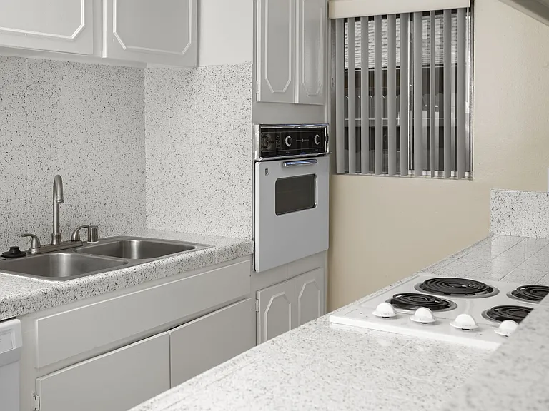 Apartment kitchen at Mango Tree Apartments in Santa Ana, CA