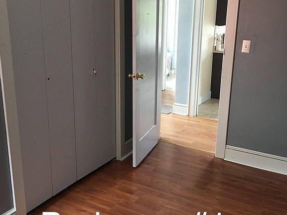 First bedroom on right across from kitchen