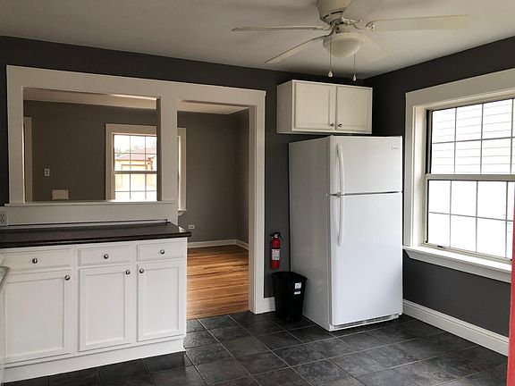 Kitchen with refrigerator, less than one year old
