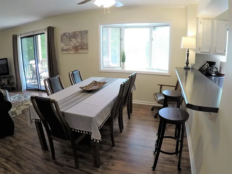 Dining area seats six, with large bay window