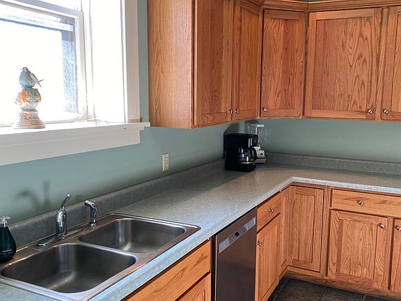 sunny kitchen and almost new dishwasher, disposal, lots of counter space