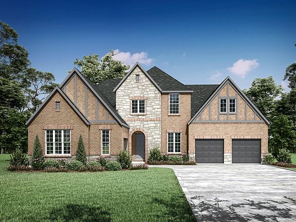 custom home with brick and stone
