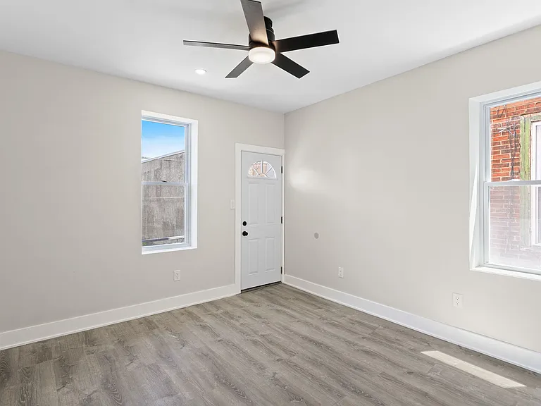 Unit 1 primary bedroom with exit to deck