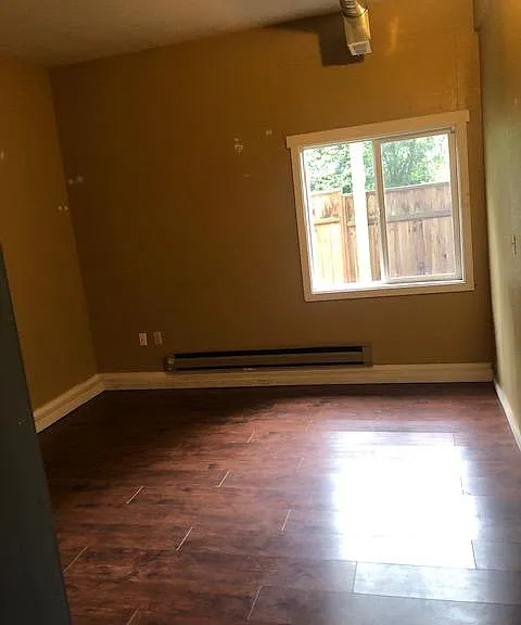 fourth bedroom with high ceiling in basement daylight floor