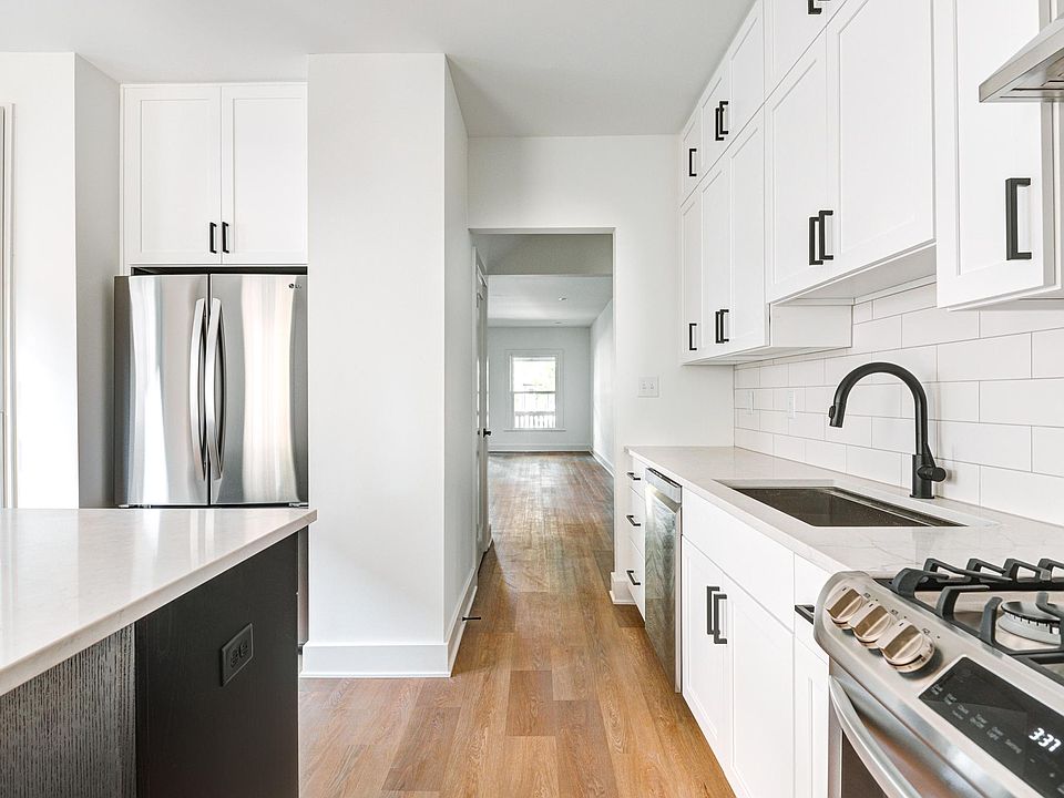 New, bright kitchen with new stainless steel appliances.
