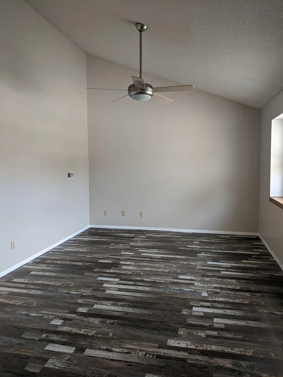 Main living room with new luxury vinyl tile planks - 224 N Osage Rd