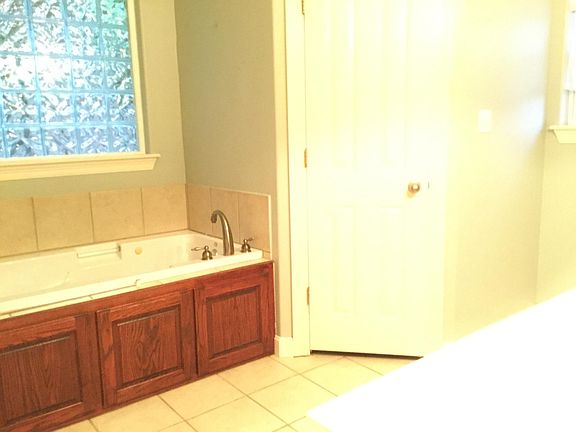 Master features whirlpool tub and seperate shower.