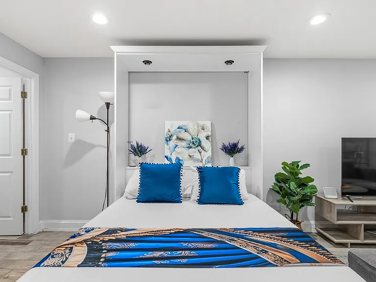 Queen Size Murphy Bed in the Living Room. Can be lifted against the wall when not in use.