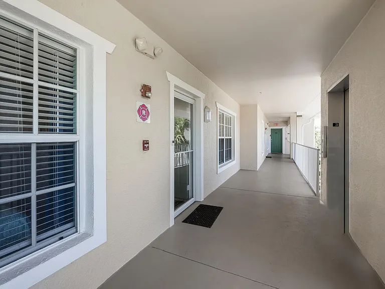 Covered hallway with elevator. Only five units per floor.