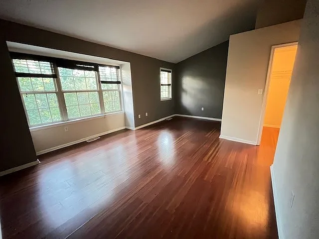 Third floor Master Bedroom with vaulted ceiling, walk-in closet and bay windows
