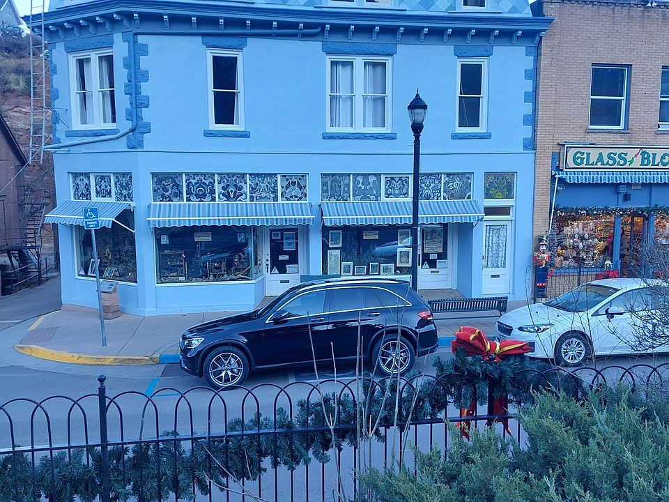 Historic Building in the heart of Manitou Springs on Canon Ave looks out onto the town clock and Manitou and Canon Avenues