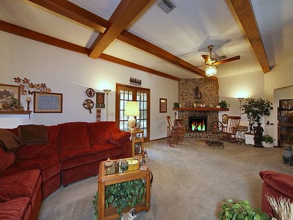 beamed ceilings and wood burning fireplace