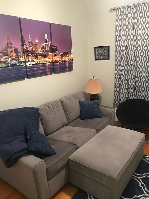 living room, closet to the left. window faces street