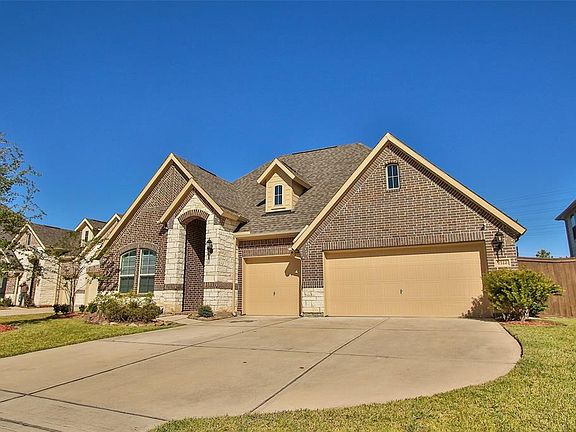 The 3-car attached garage is a rare and appreciated find in a planned community.
