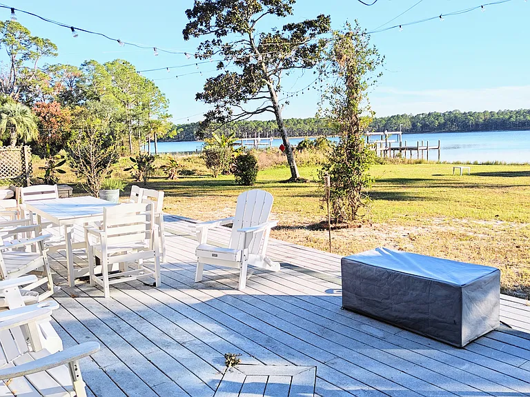 Front deck, fire pit, string lights, grill, outdoor furniture.