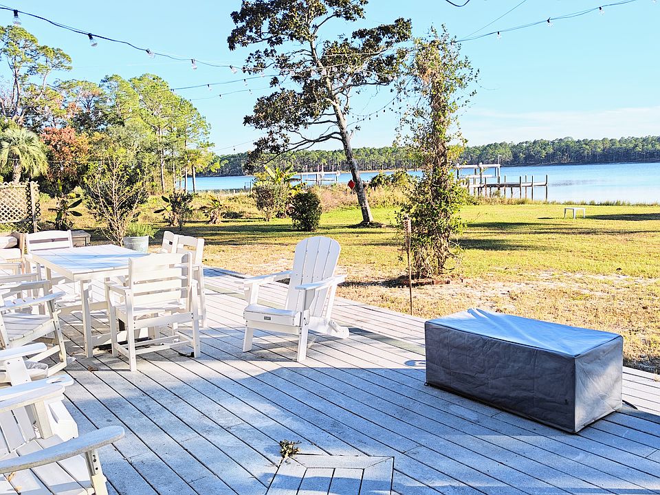 Front deck, fire pit, string lights, grill, outdoor furniture.