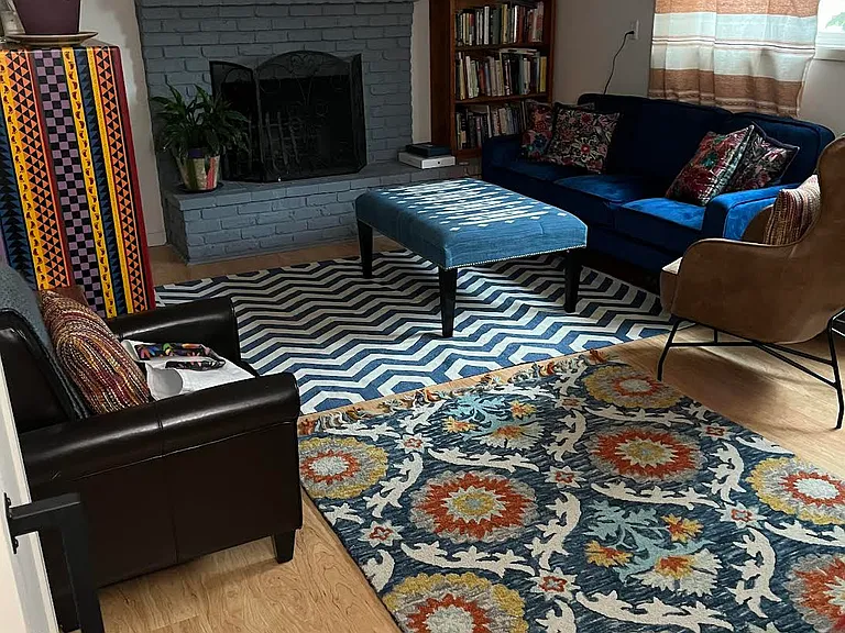 This is a large room with room for dining table. This picture contains former tenant's furniture.