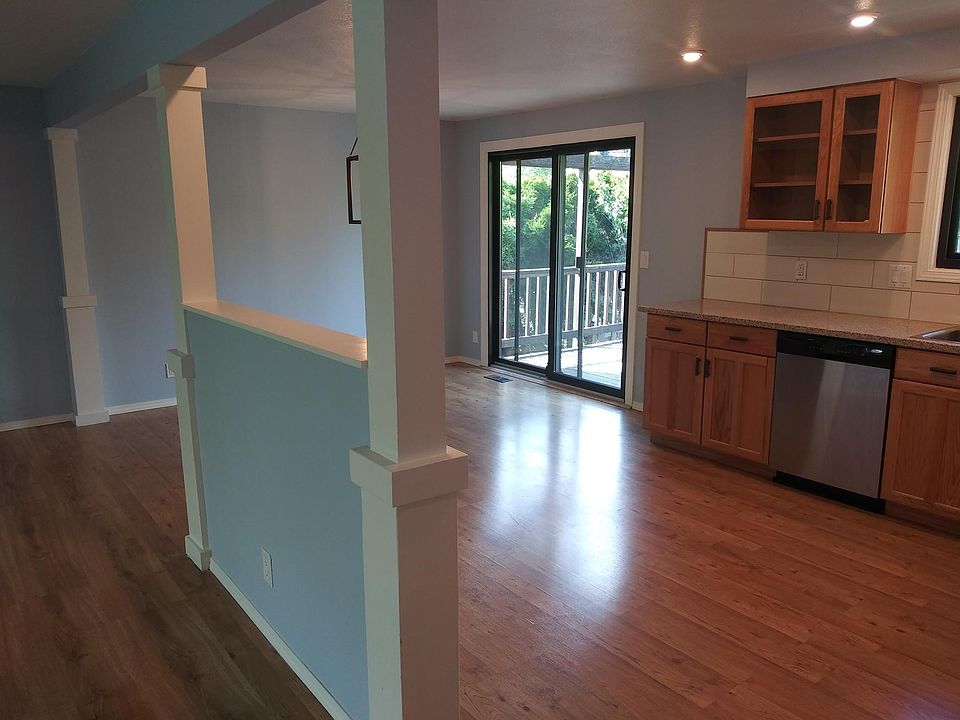 A view of the kitchen and dining room from the entry stairs.