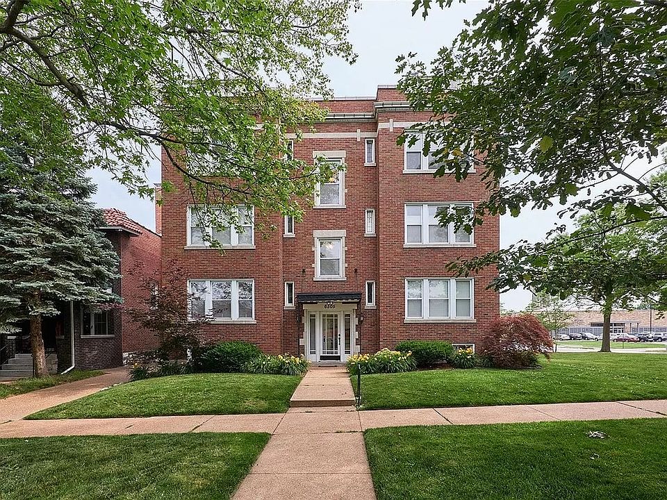 Front of building -- tree lined street