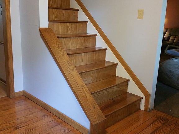 wood floor foyer and stairs