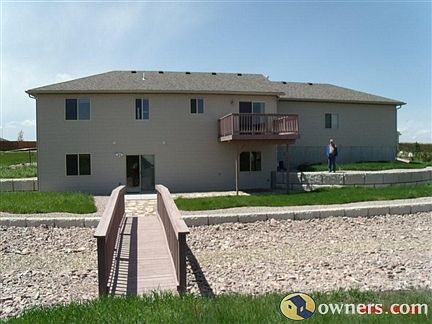 Back of home, featuring bridge