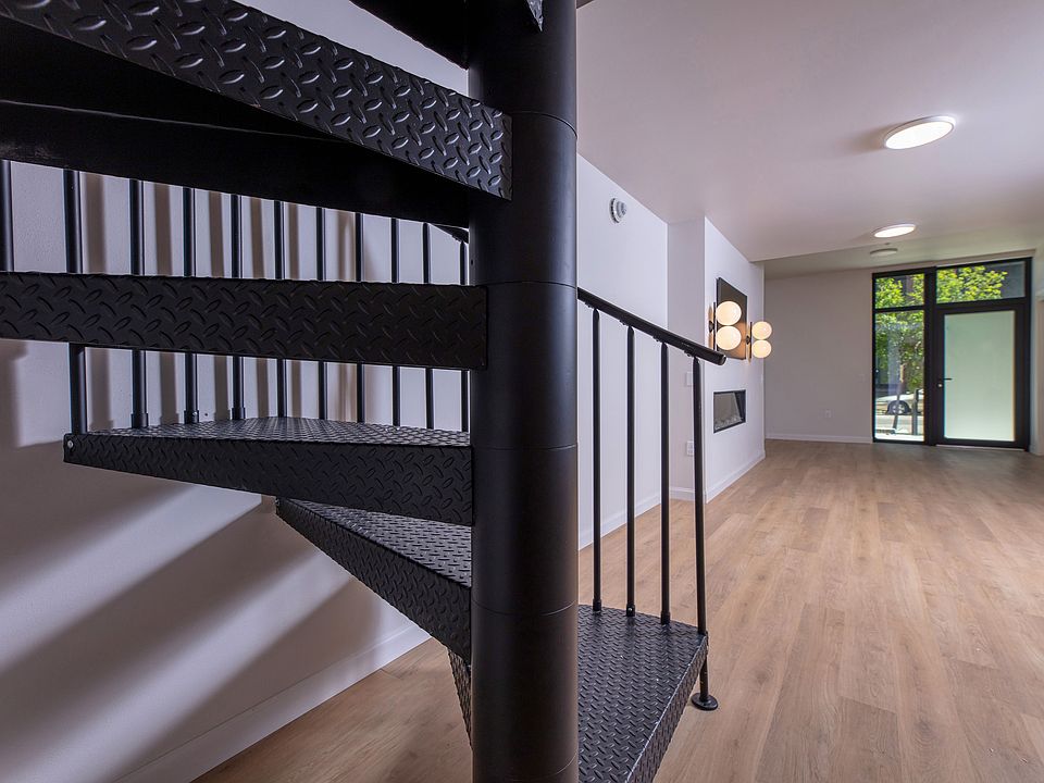 The unique spiral staircase leads you upstairs to the bedrooms