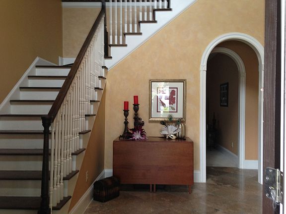 Travertine floors in foyer