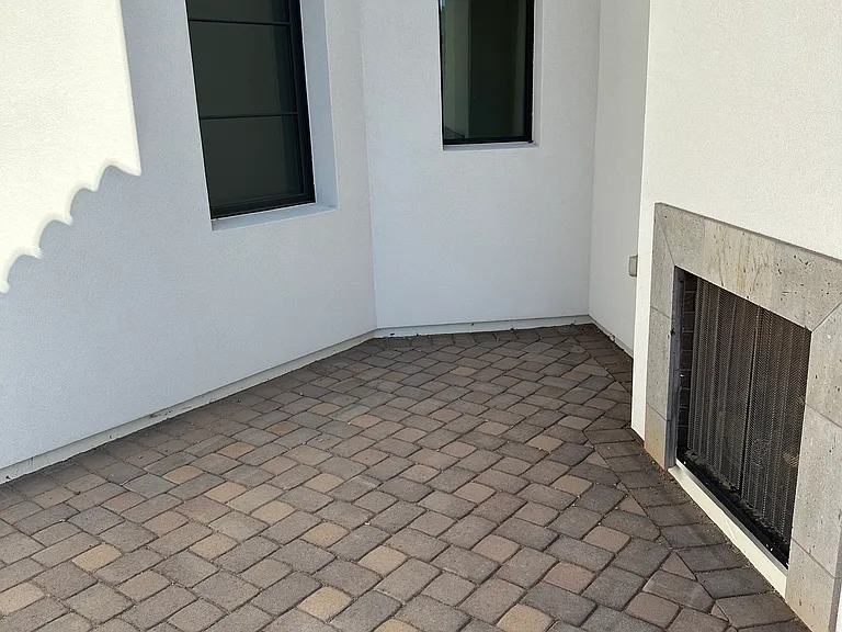 Private patio adjoining study and master suite, with outdoor fireplace