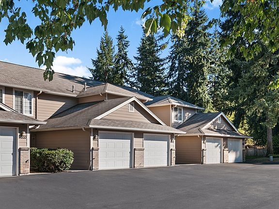 Attached garages provide convenient parking and direct access at Mountain Park Townhomes.