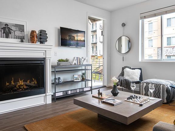 Large living room with wood-style flooring