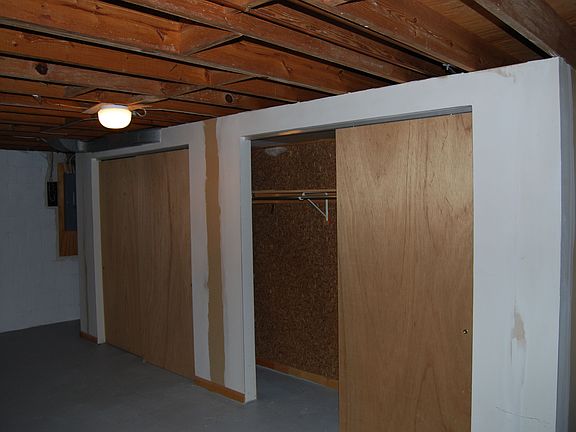double your living space with this unfinished basement with cedar closets.