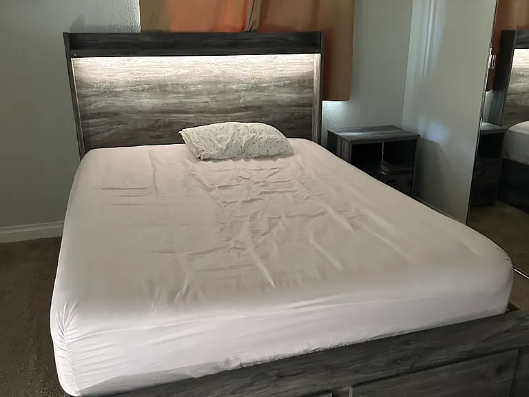 Brand new Master Bedroom, Queen bed frame. Has 6 drawers underneath and nightlight under the small shelf at the top. New night stand as well. Lamp will be added in to the night stand. -Missing from this picture.