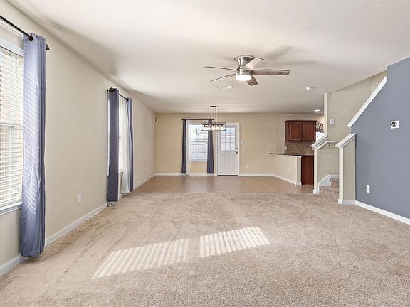 Perfect for entertaining family and friends, the living area is open to the kitchen.