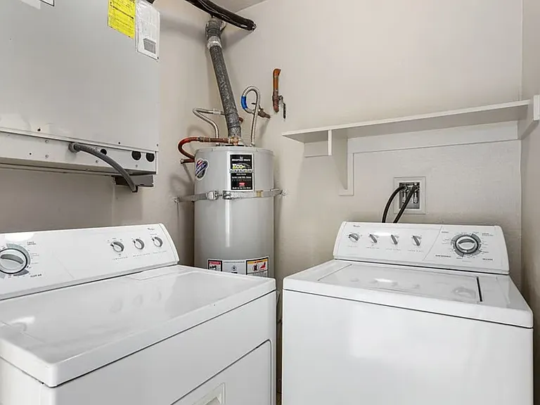 Private laundry area off of back porch.