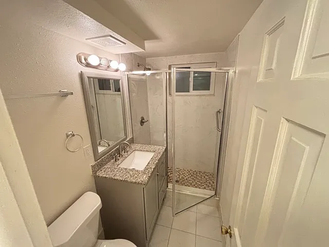 Tiled floor and shower, downstairs
