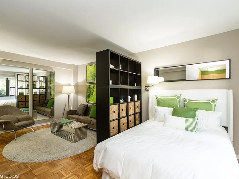 Studio model view of bed and living spaces