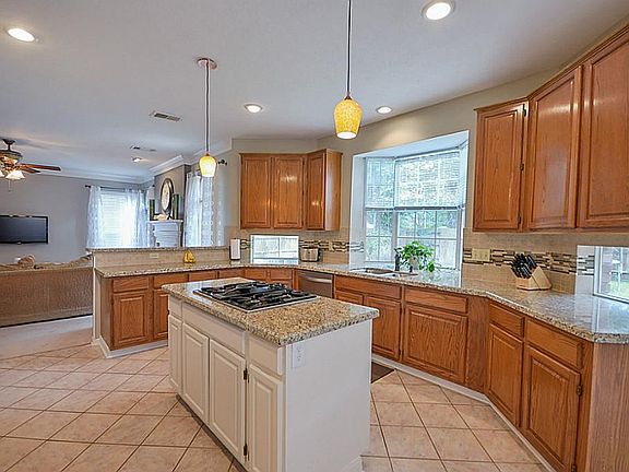  Beautiful new granite in the Kitchen with painted island and large gas cooktop.